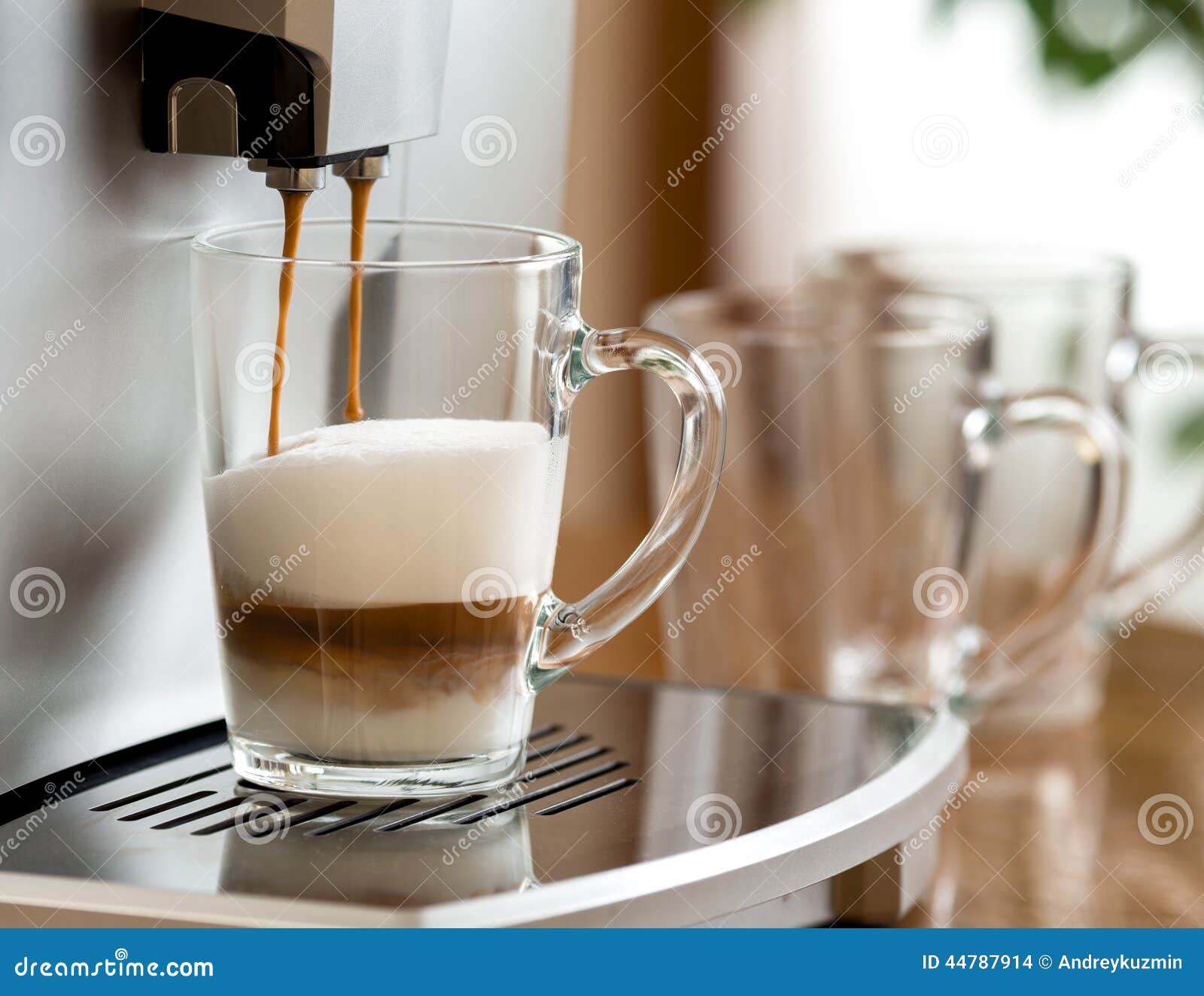Cappuccino Coffee Preparing in Glass Cup with Machine Stock Photo