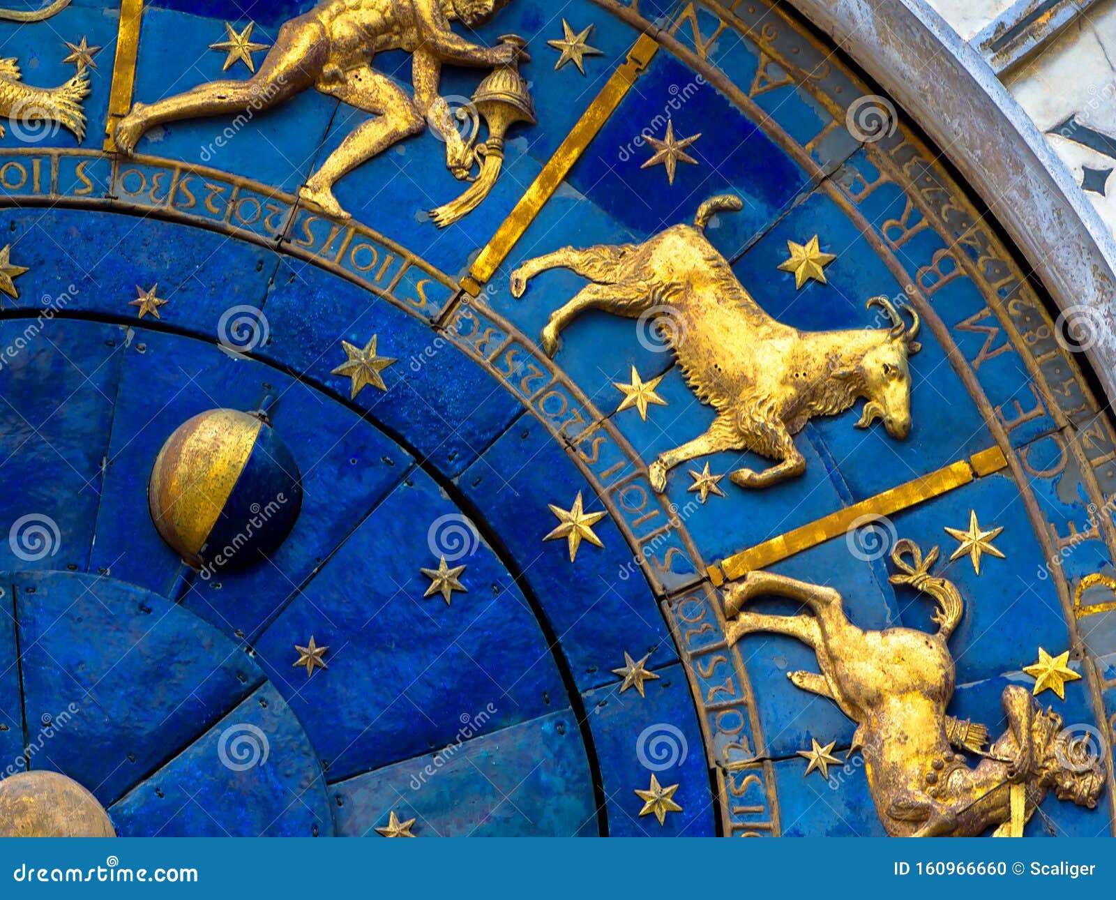 capricorn astrological sign on ancient clock. detail of zodiac wheel with moon and constellations