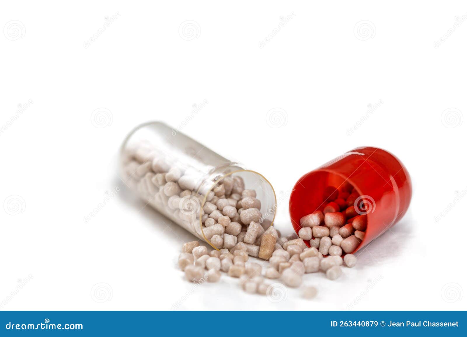 Pharmacy Capsule Opened in Half Pouring Its Contents. Stock Image