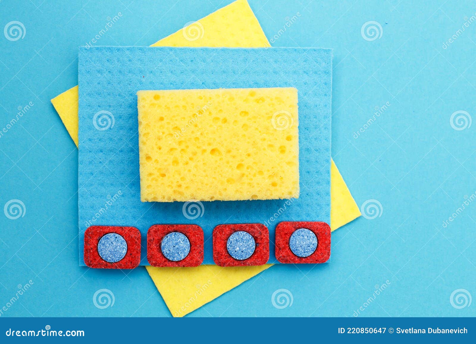 Capsules for Dishwashers, Kitchen Rags and Sponges on a Blue Background. Flat Lay Stock Image