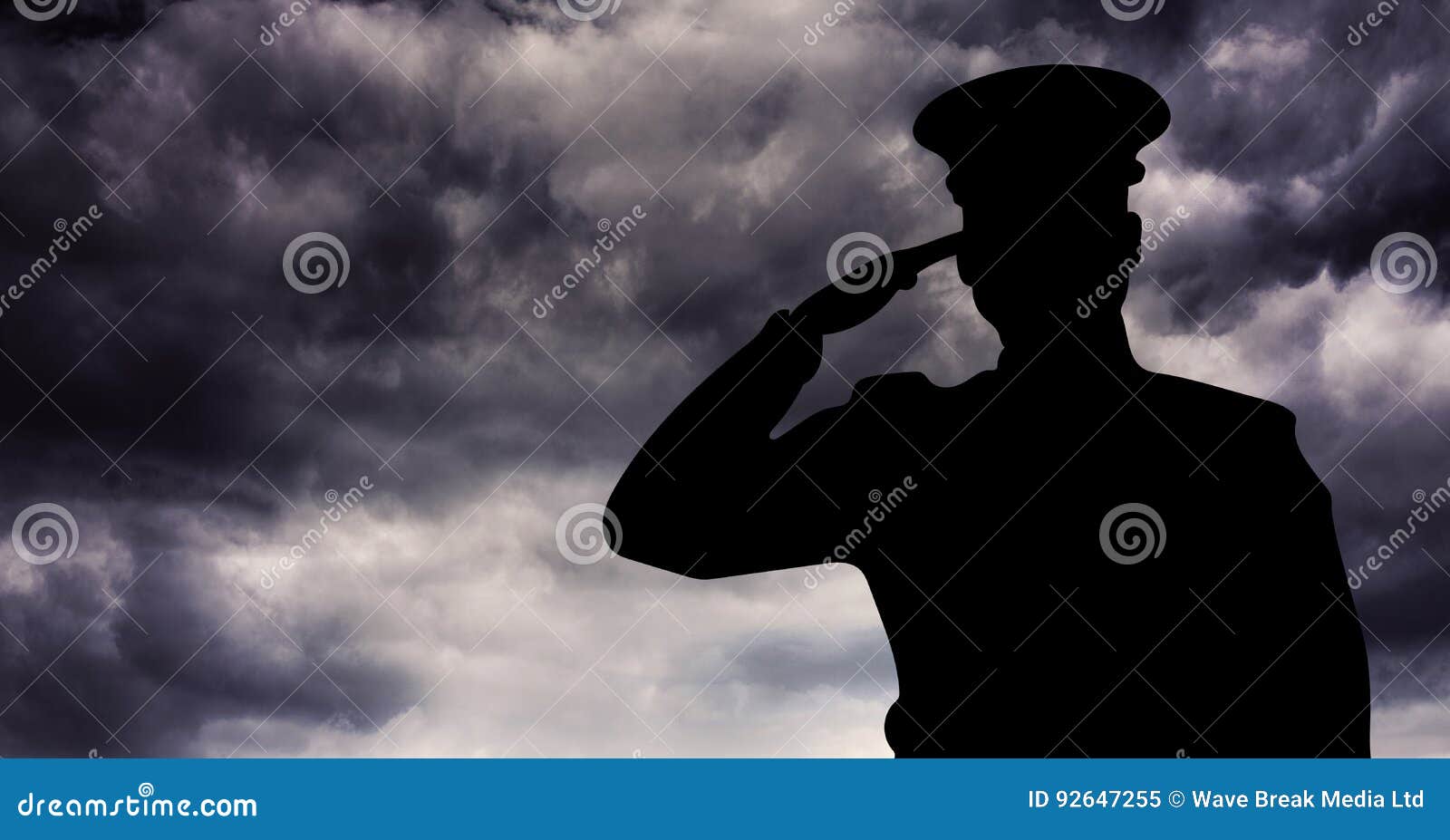 captain silhouette saluting against storm clouds
