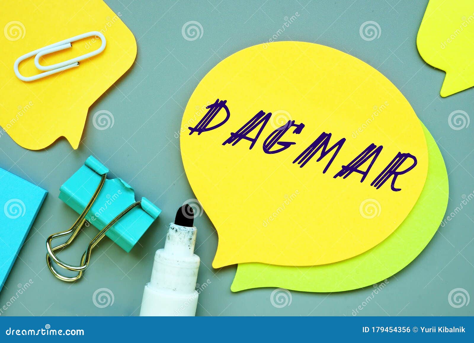 the caption in the picture is dagmar. notebook sheet, table, pens