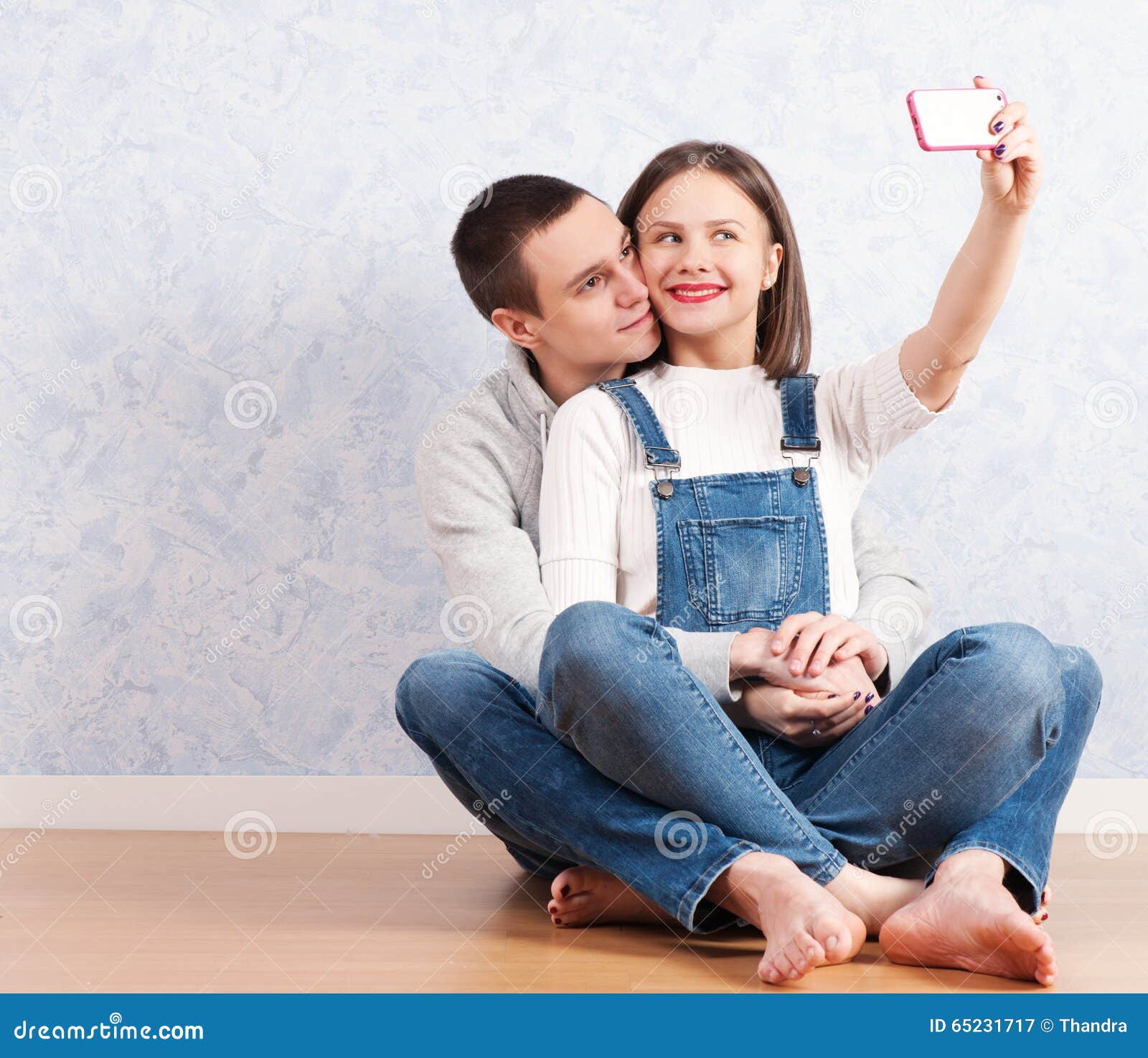 capturing happy moments together. happy young loving couple making selfie