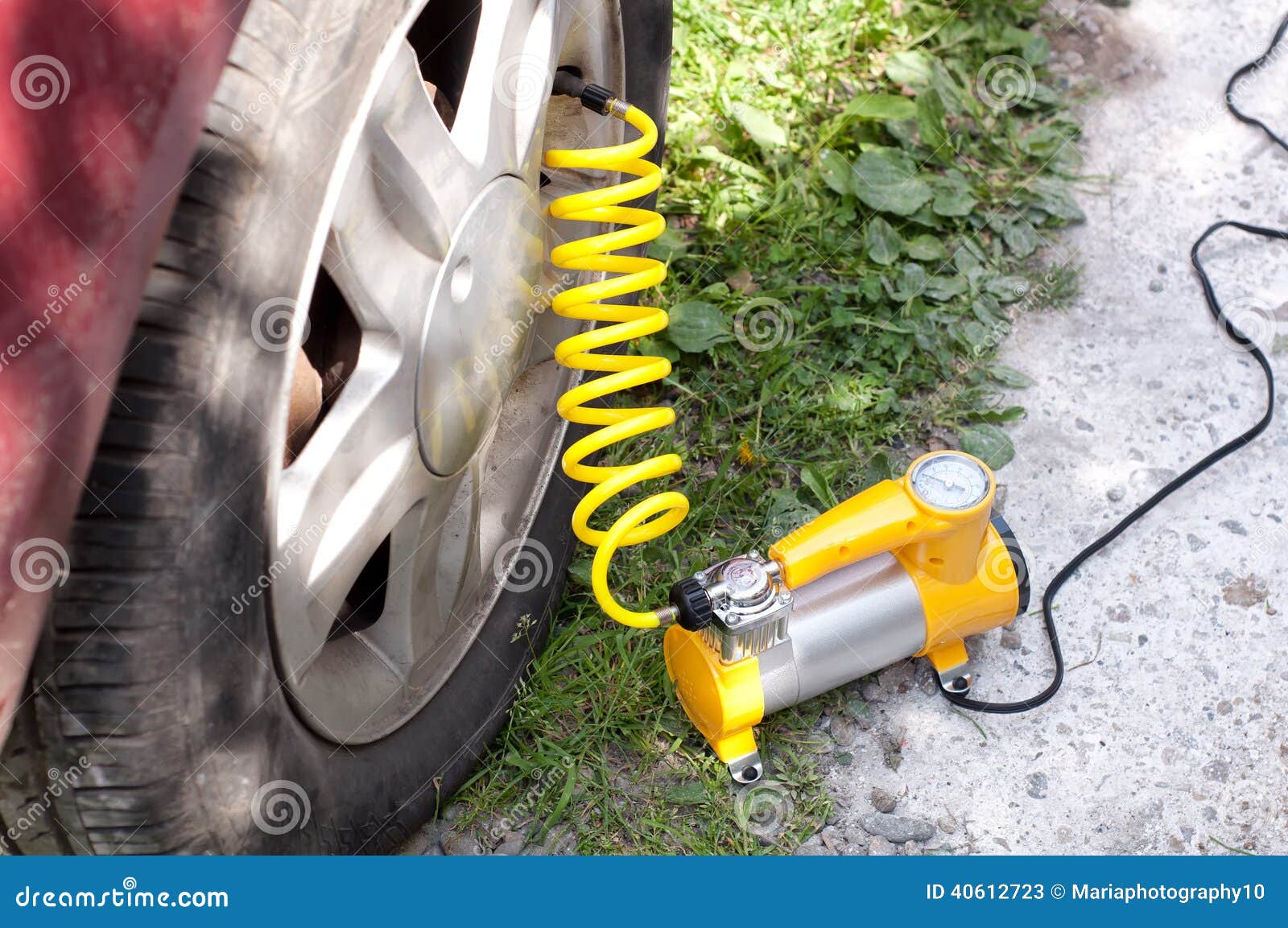 Car Air Compressor with Yellow Twisted Hose Stock Image Image of