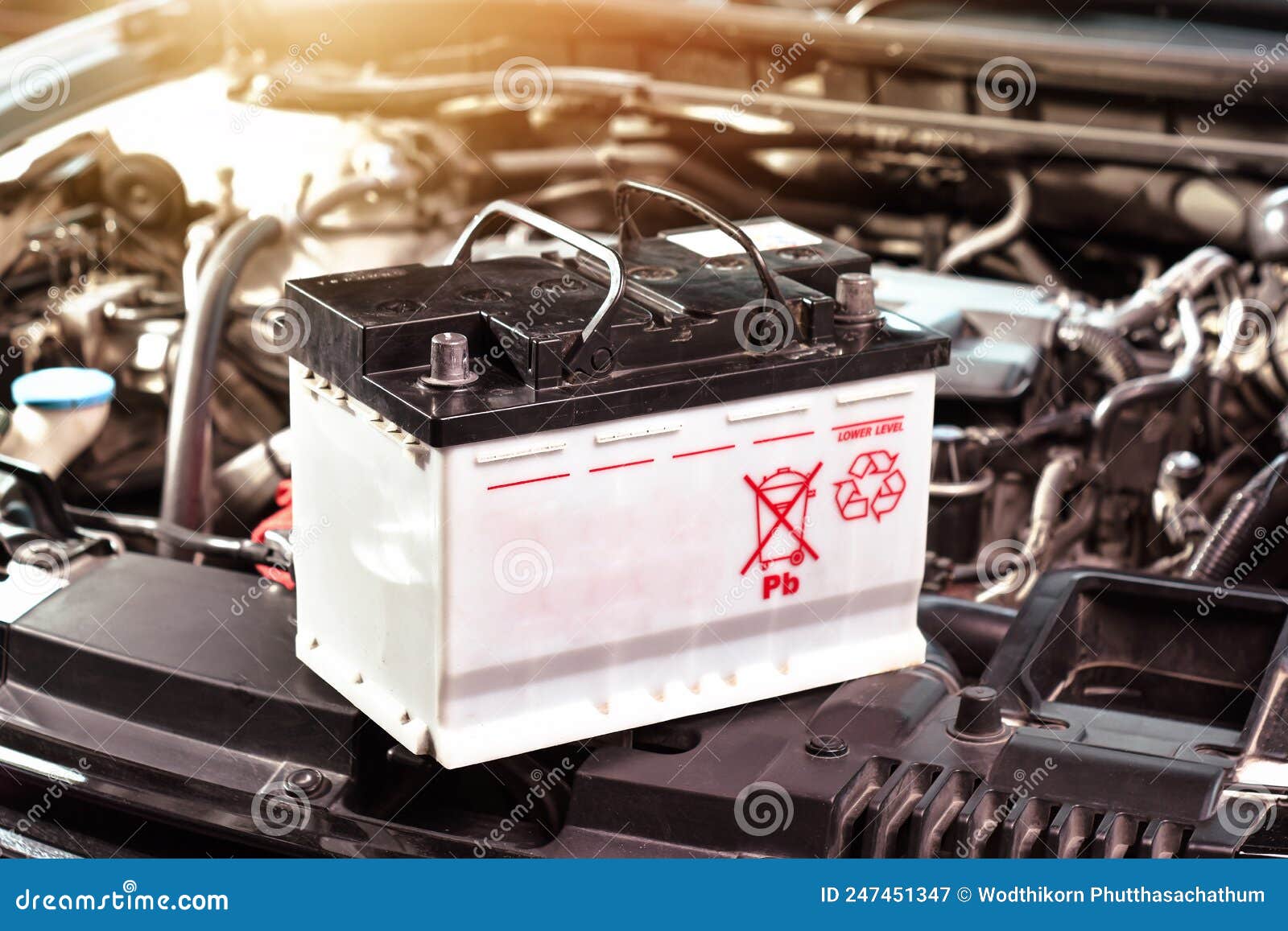 The Car Battery of the Automobile Electrical System in the Engine Compartment for Car