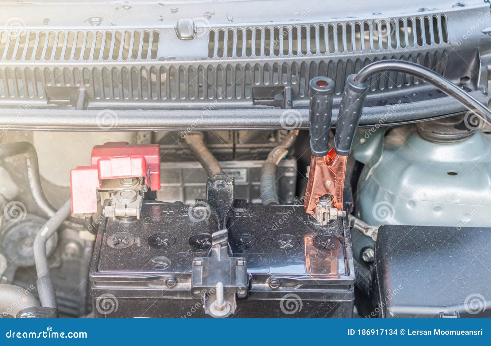 A Car Battery Jumper Cables To Charge a Dead Battery Stock Photo