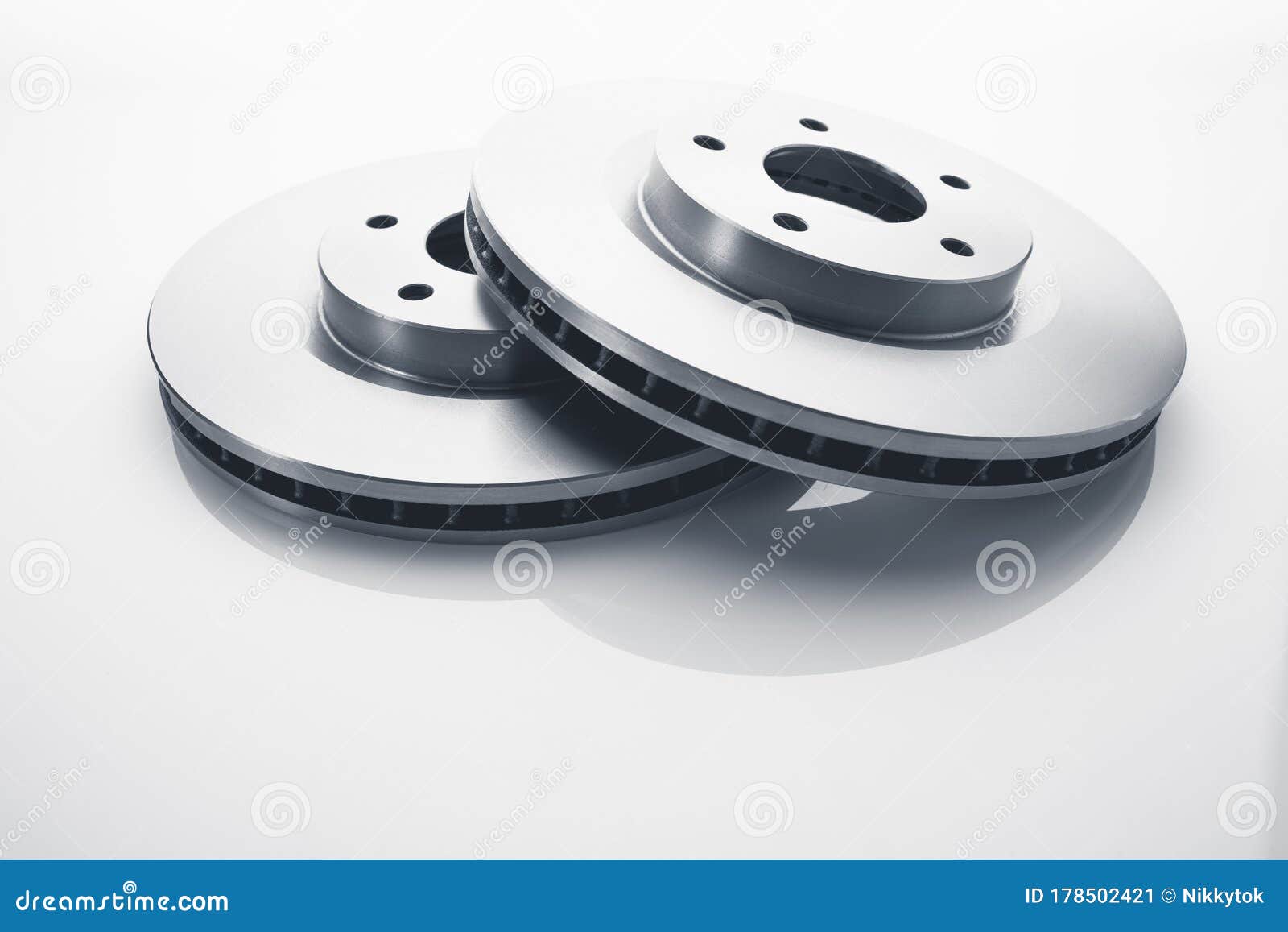 New Brake Discs Grease Coated On A Passenger Car. Car On A Lift In A