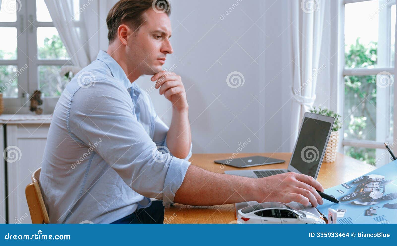 car  engineer working on car prototype for automobile business synchronos
