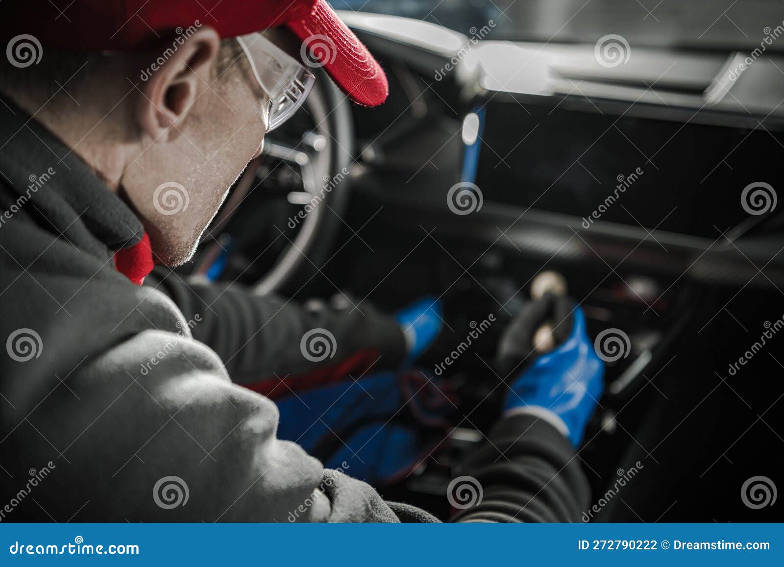 Car Detailer Cleaning and Protecting Leather Vehicle Interior