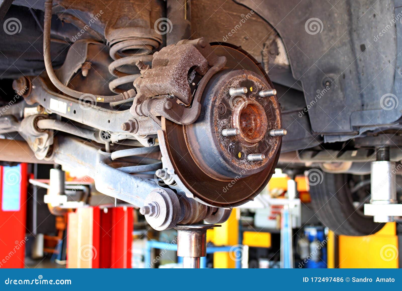 Car Disc Brakes and Visible Shock Absorbers without Wheel Stock Photo