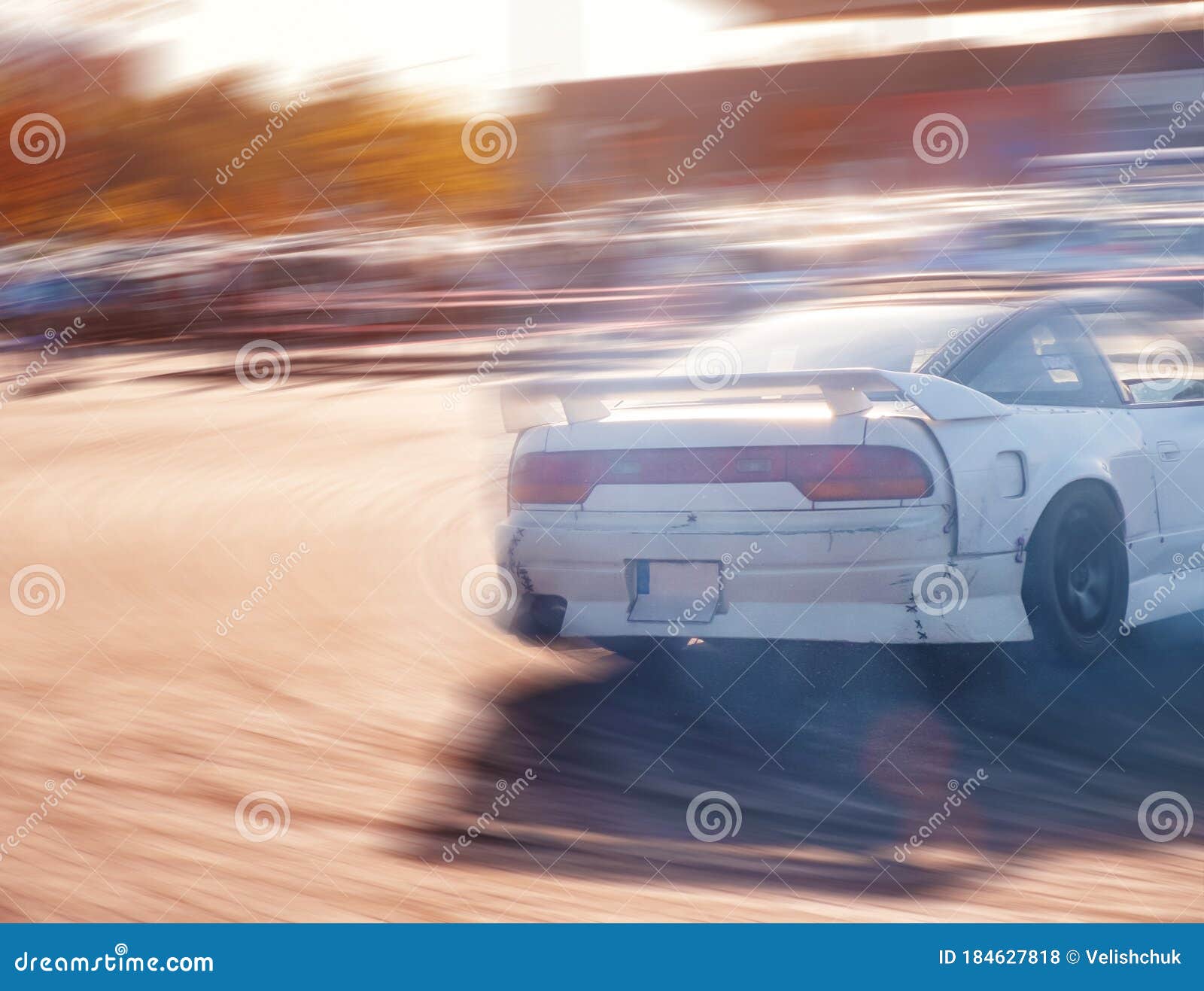 Car drifting, Blurred of image diffusion race drift car with lots of smoke  from burning tires on speed track Stock Photo