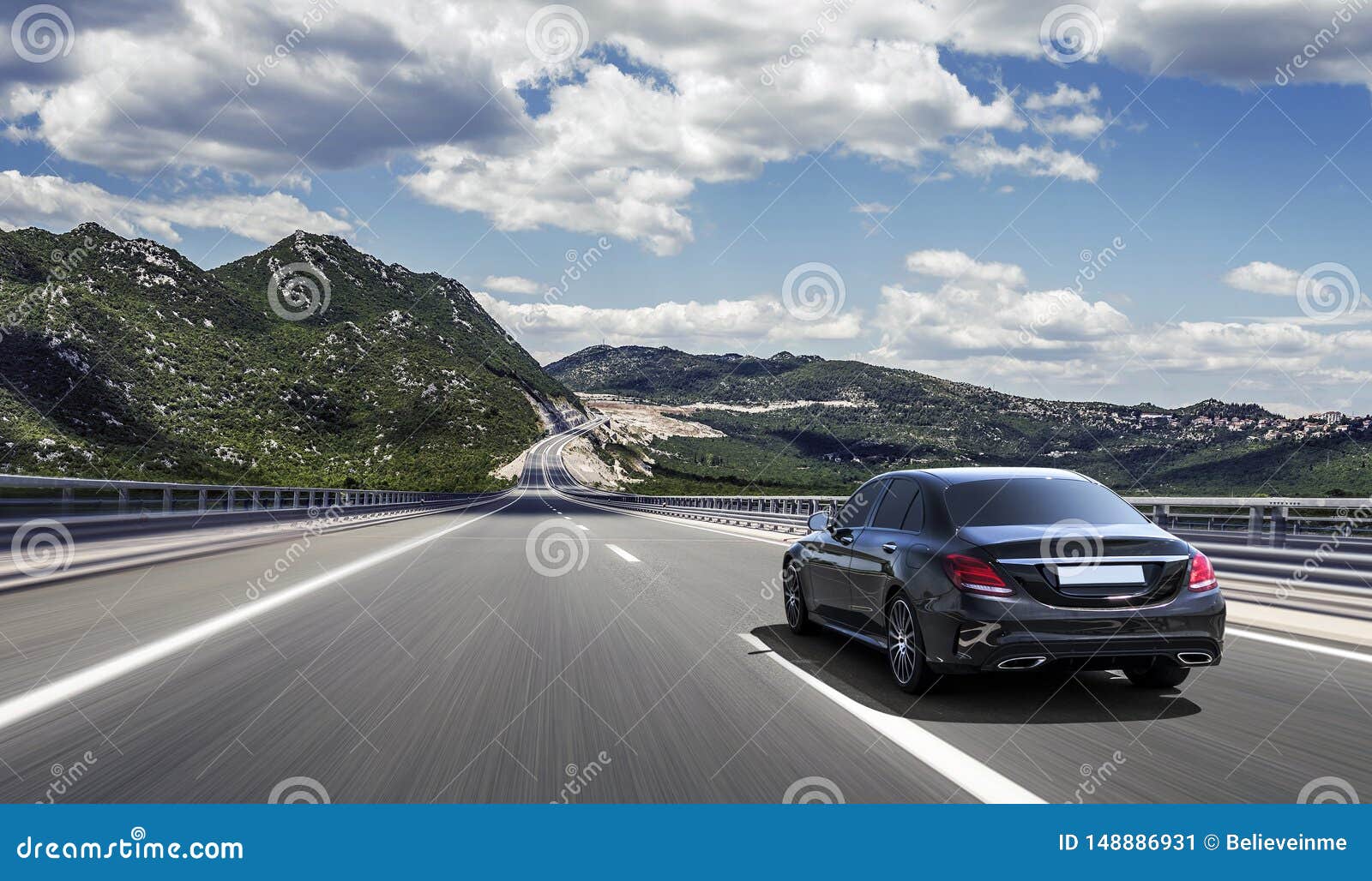 Car Drives Fast on a Highway in the Highlands. Stock Image Image of