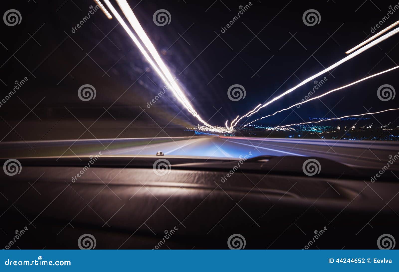 a car driving on a motorway at high speeds.