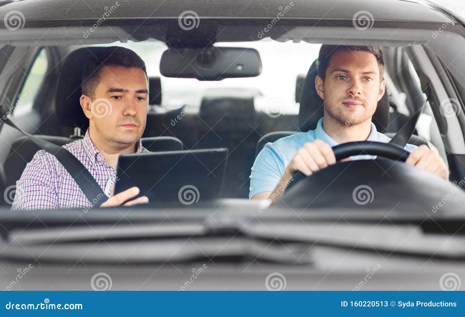 Car Driving School Instructor and Young Driver Stock Image - Image of