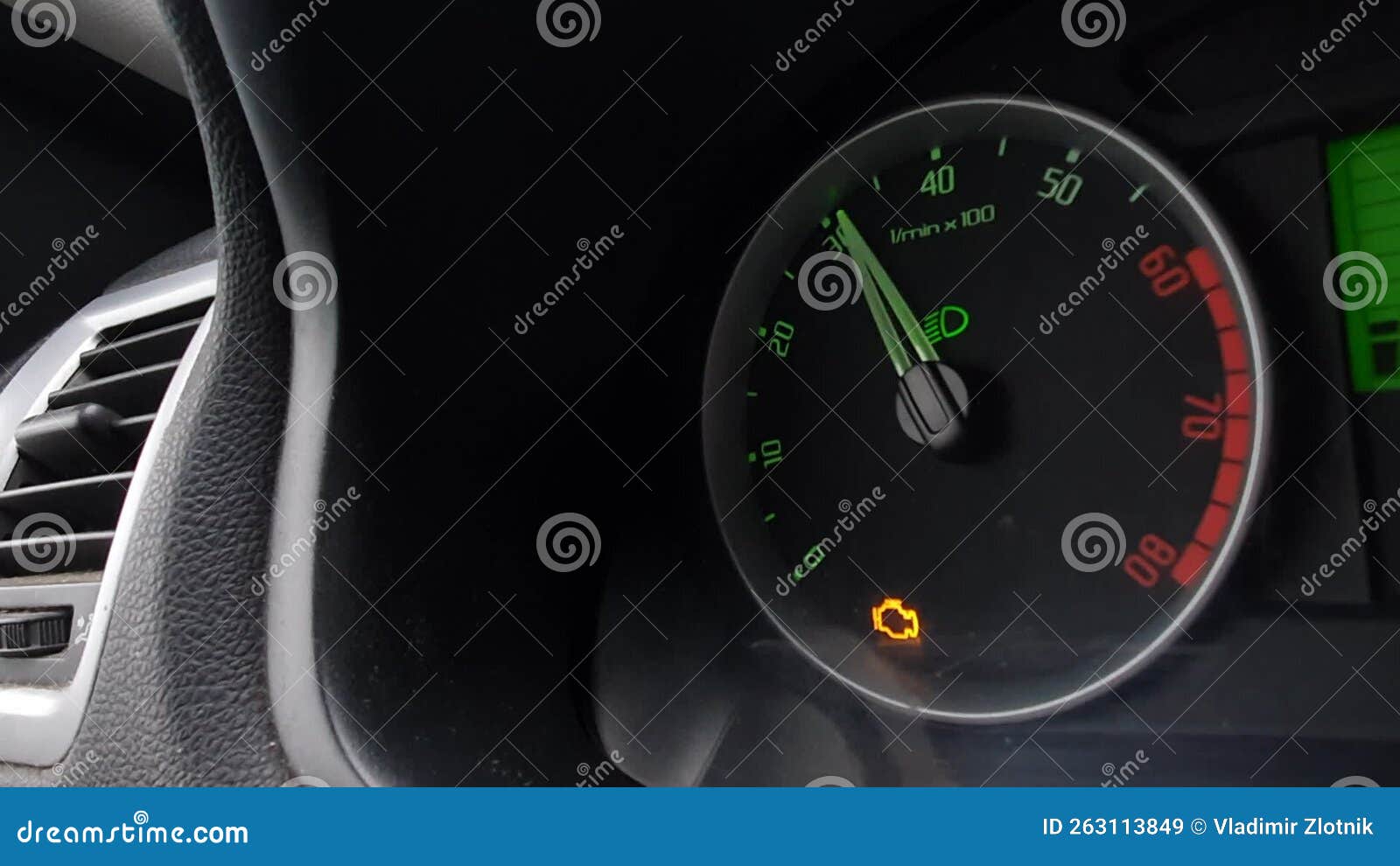 The Engine Error Light on the Dashboard of the Car. Problems with the