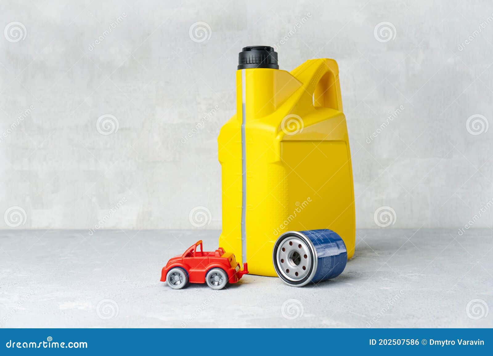 Car Engine Oil Change Concept with Yellow Oil Canister, Oil Filter and