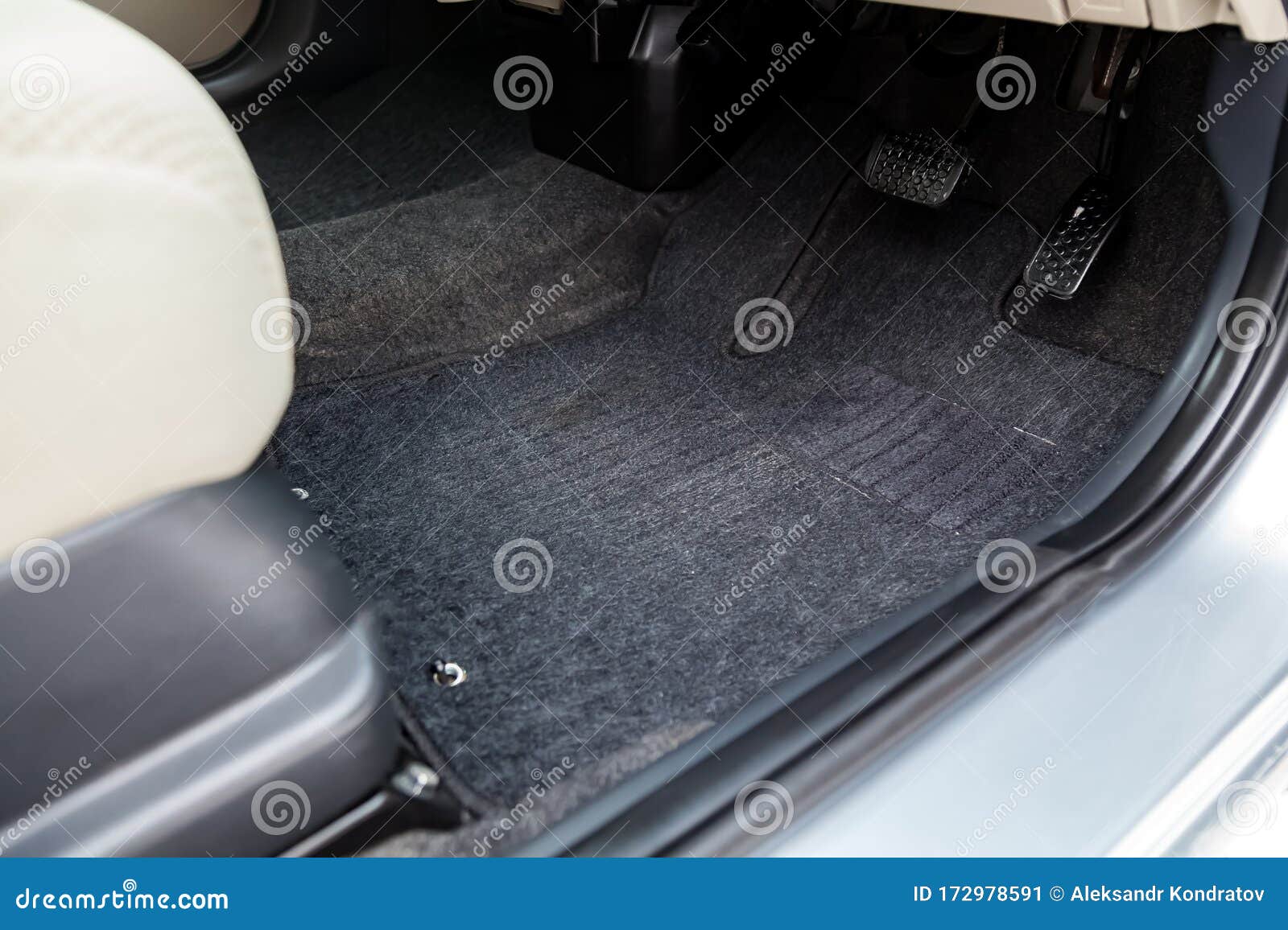 Car Floor Mats Of Black Carpet With Gas Pedals And Brakes In The