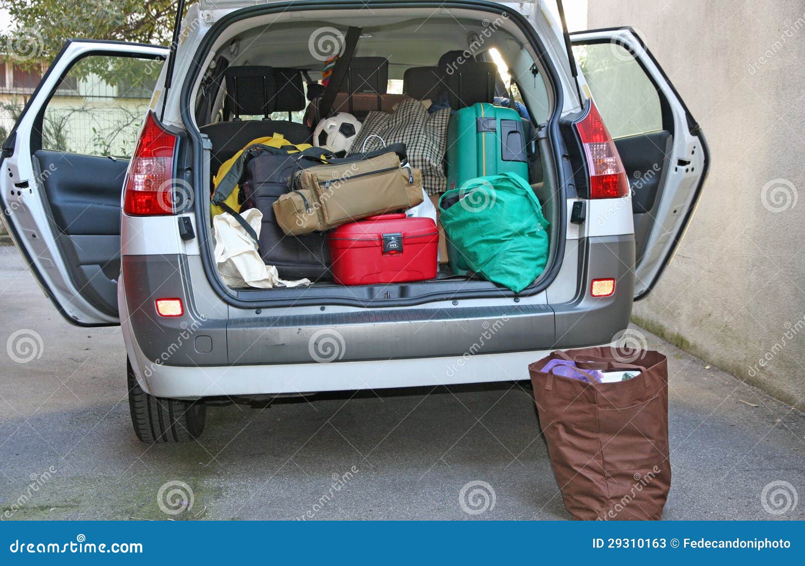 car full of luggage before departure