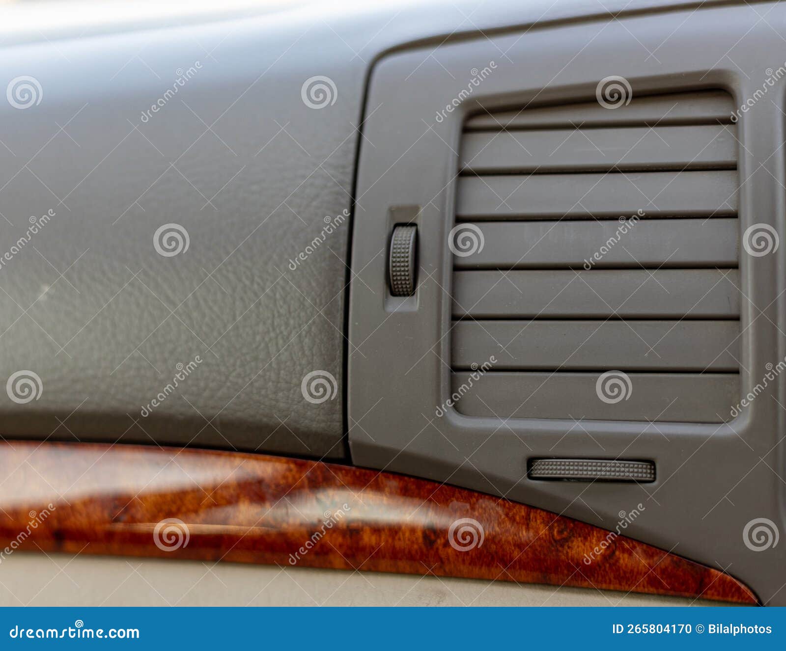 Car Heater or Air Conditioner Vent in the Front Panel of the Car