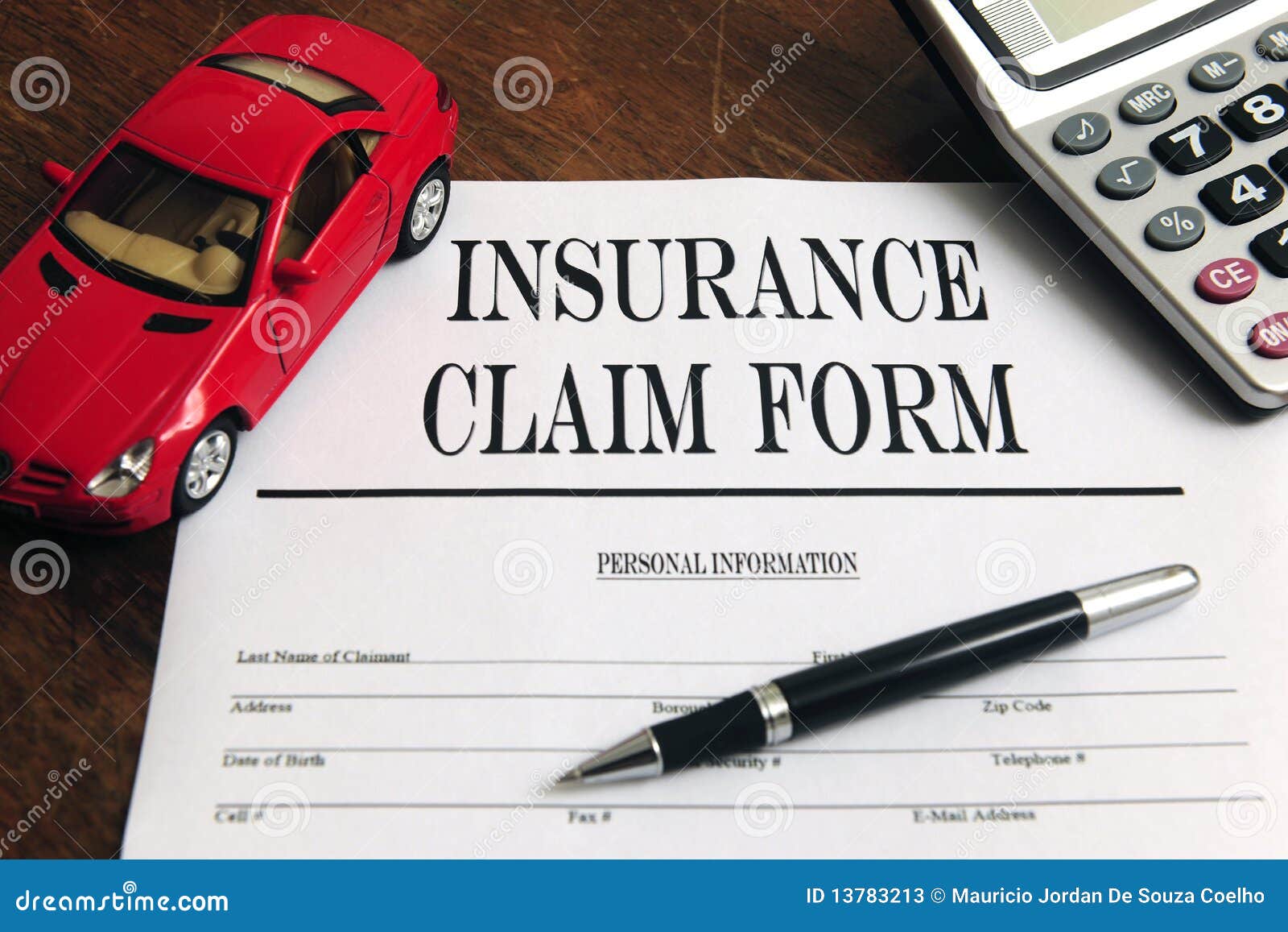 Car Insurance Claim Form On Desk Stock Photos - Image: 13783213