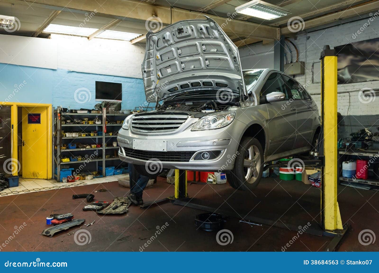 Car On A Lift In Garage Stock Photos - Image: 38684563 Car On A Lift In Gar
