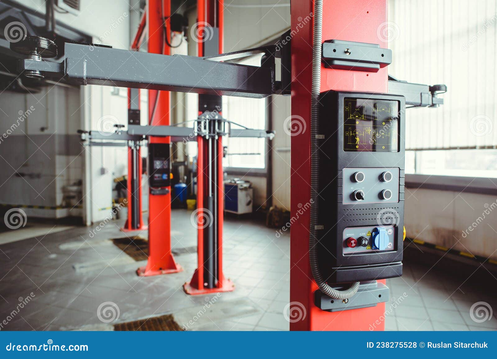 Car Lift in Car Service with Soft Focus, Car Maintenance Stock Photo