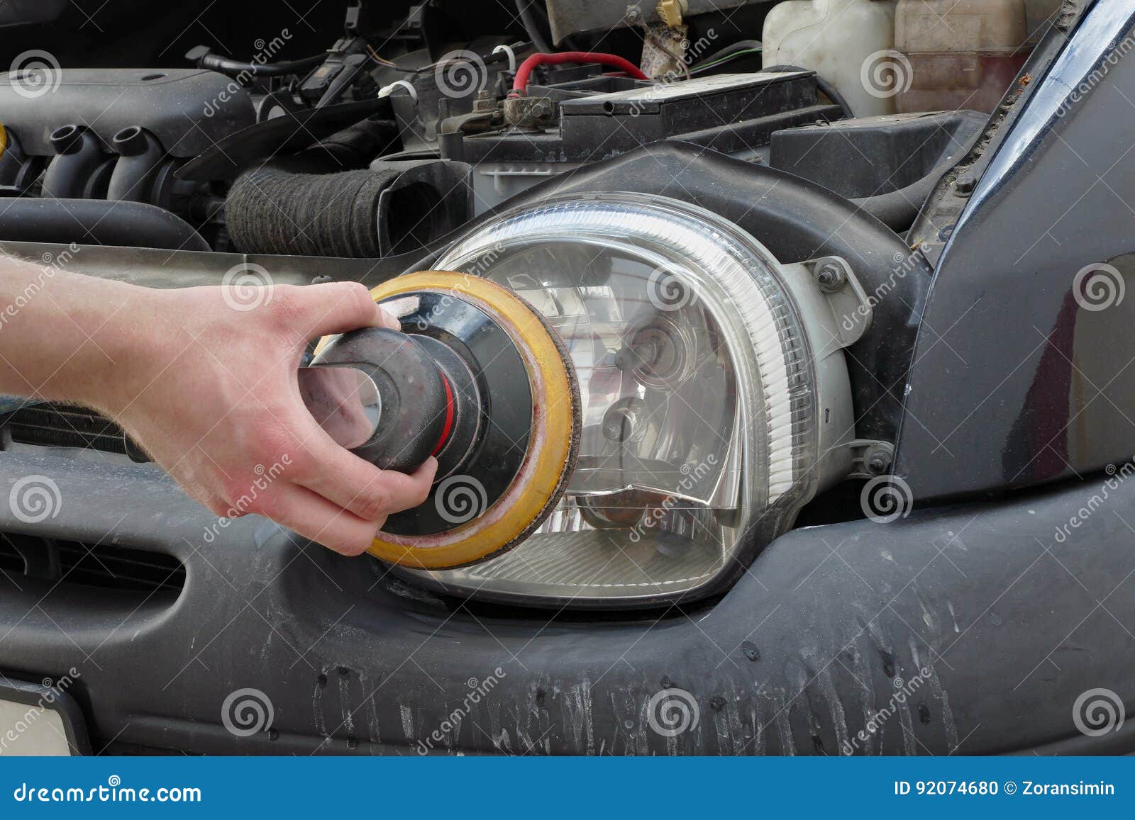 Car Light Repairing, Hand with Tool Polish Headlight Stock Photo