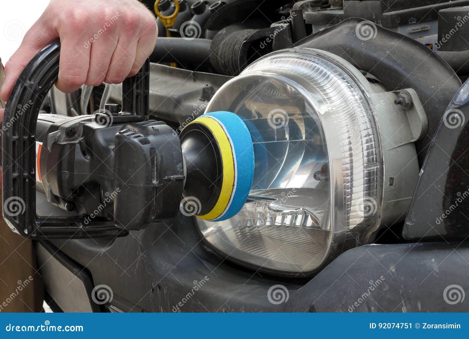 Car Light Repairing, Hand with Tool Polish Headlight Stock Image