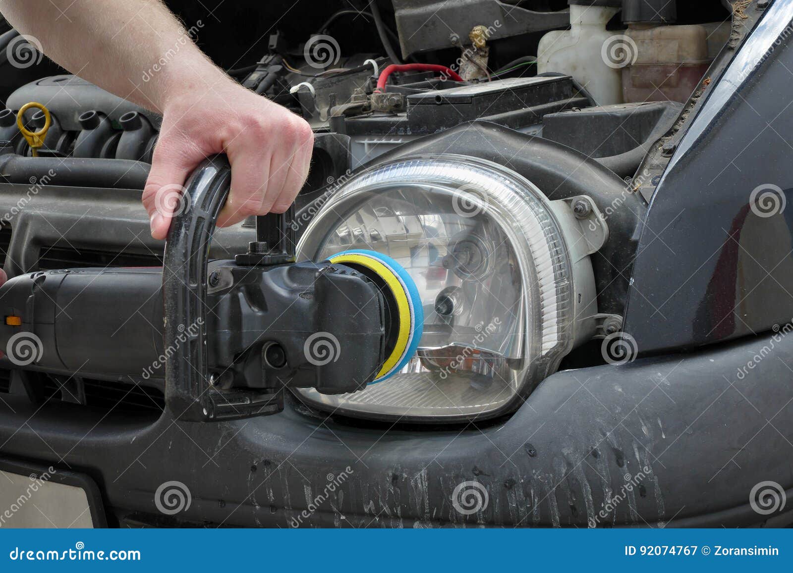 Car Light Repairing, Hand with Tool Polish Headlight Stock Image