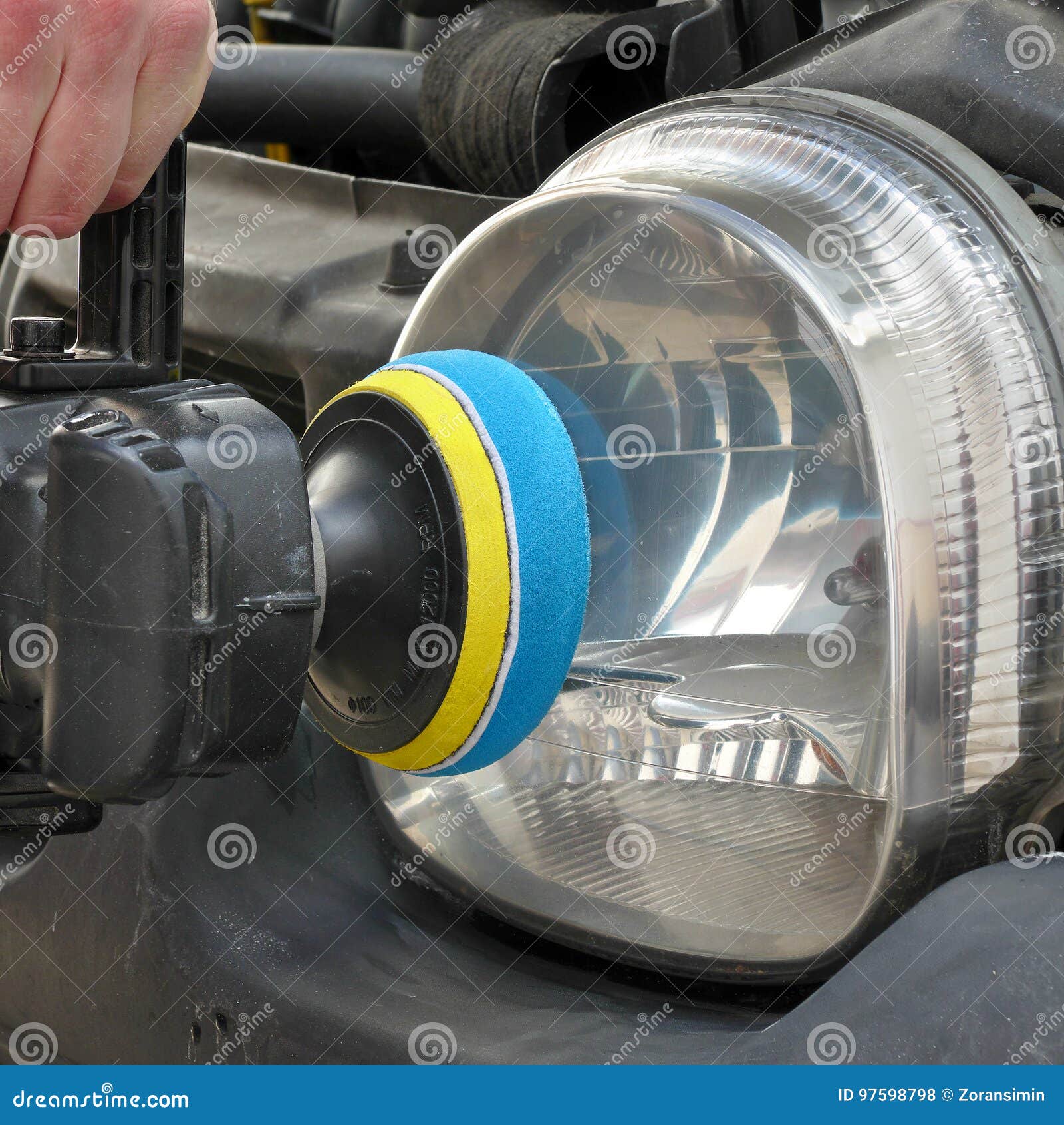 Car Light Repairing, Hand with Tool Polish Headlight Stock Photo