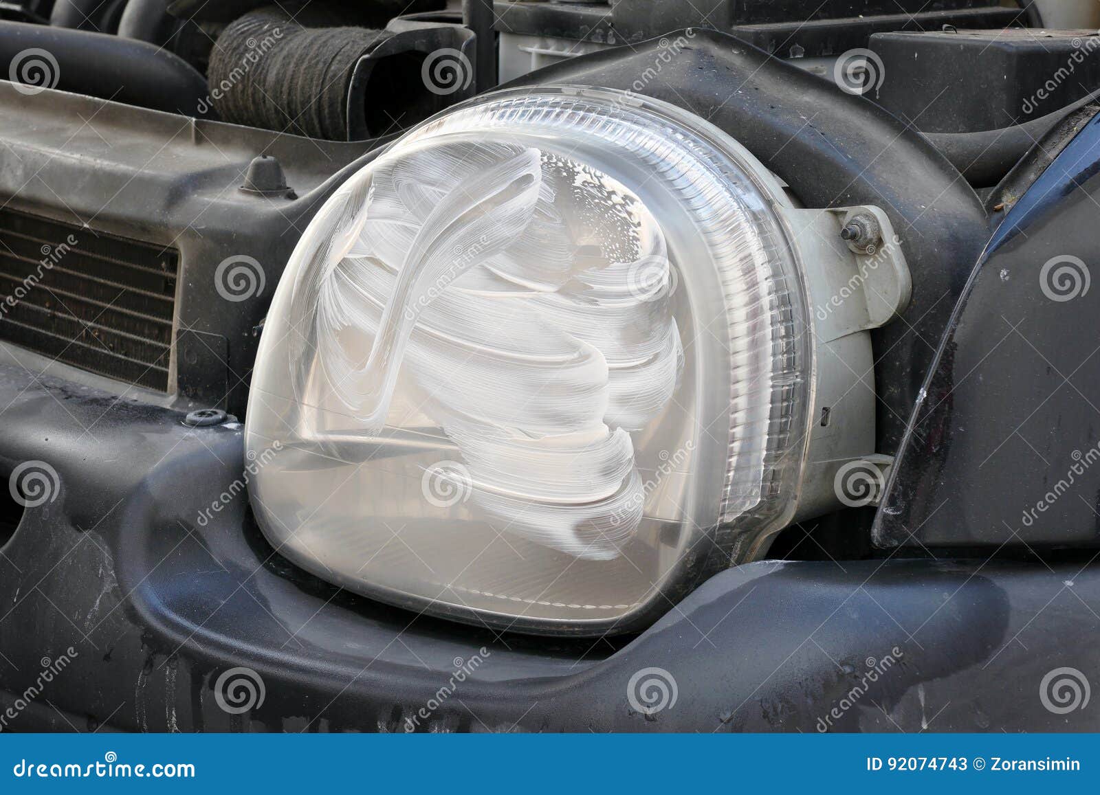 Car Light Repairing, Polishing Compound at Headlight Stock Image