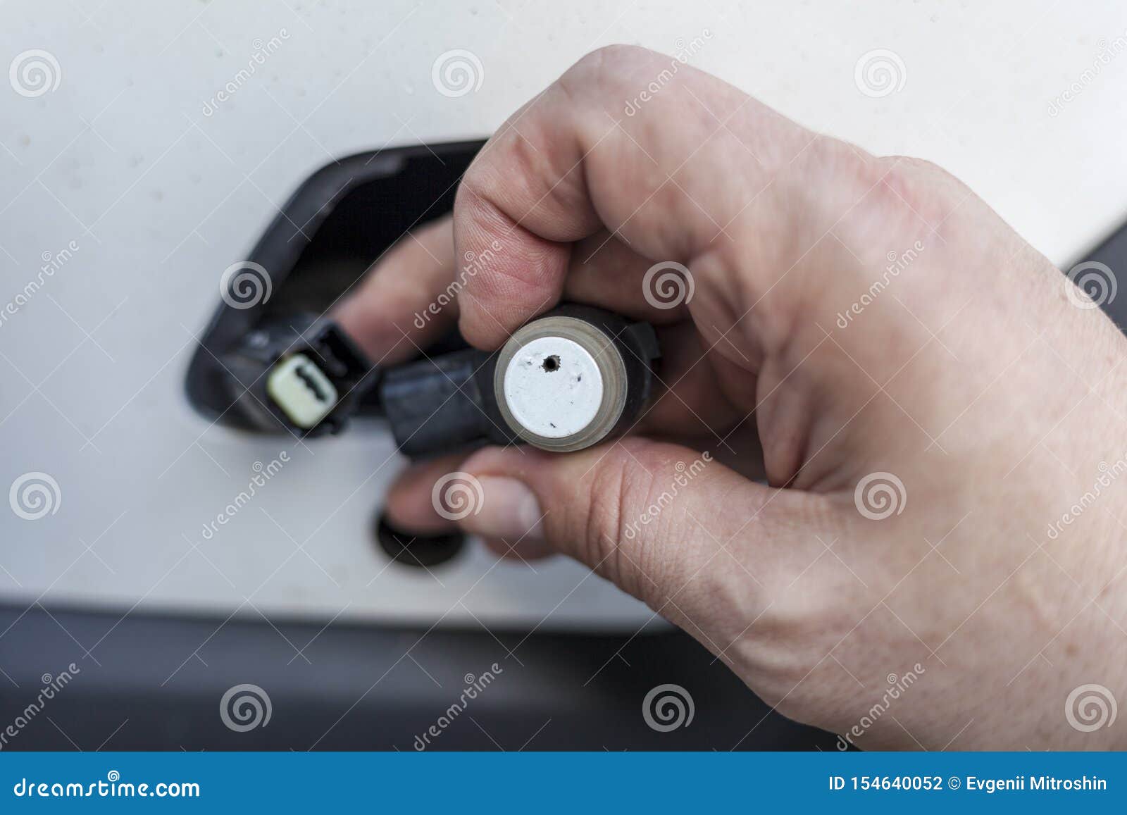Car Mechanic Changes the Parking Sensor on the Car, the Sensor Malfunction of Parking Sensors