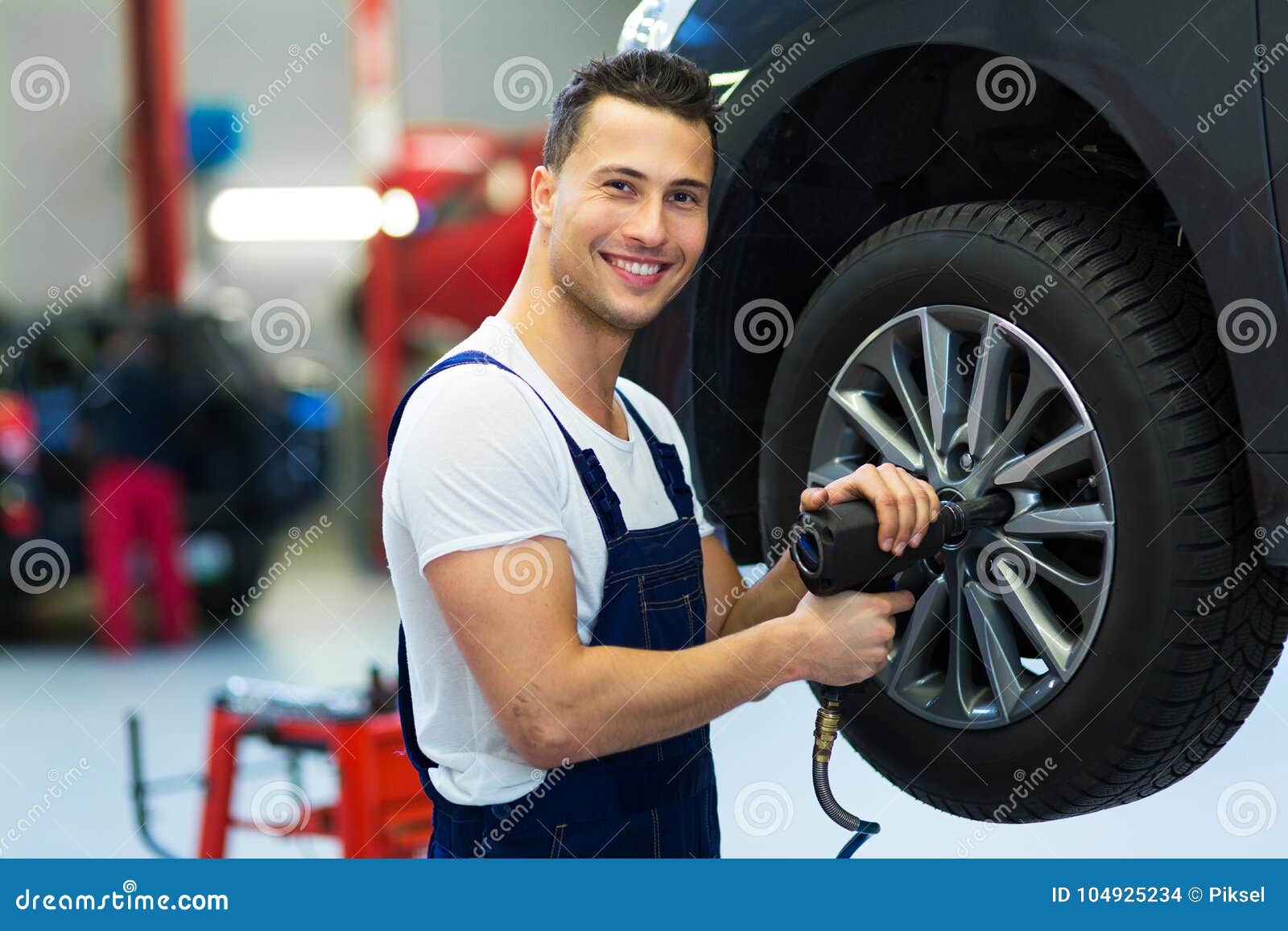 car mechanic changing tires