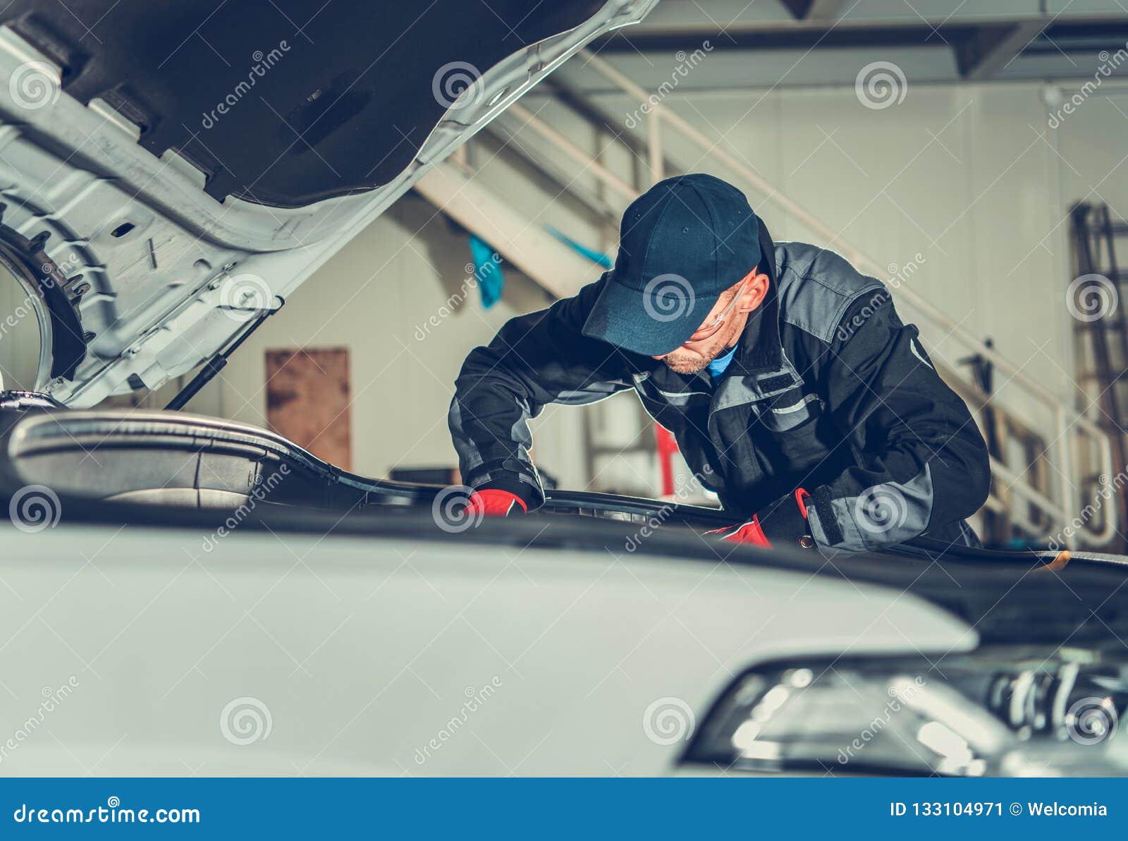 Car Mechanic on Duty stock image. Image of modern, under 133104971