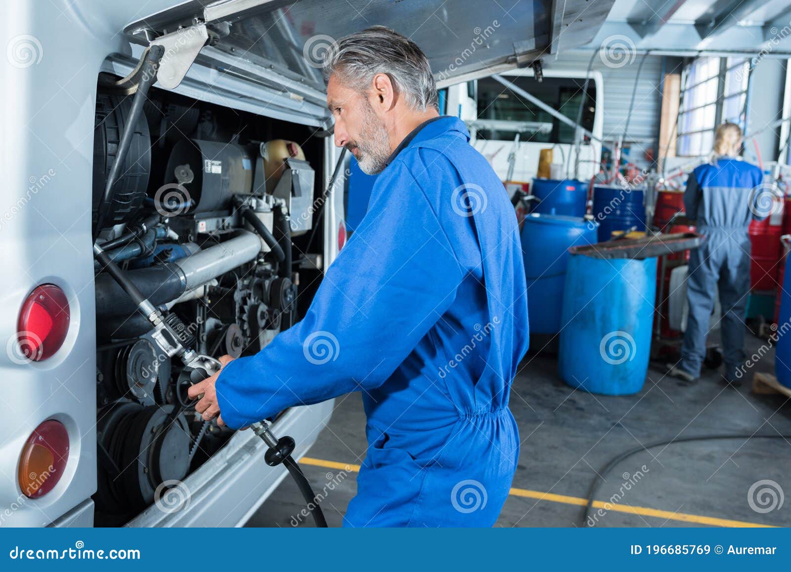 Car Mechanic at Garage Checking Car Stock Image Image of