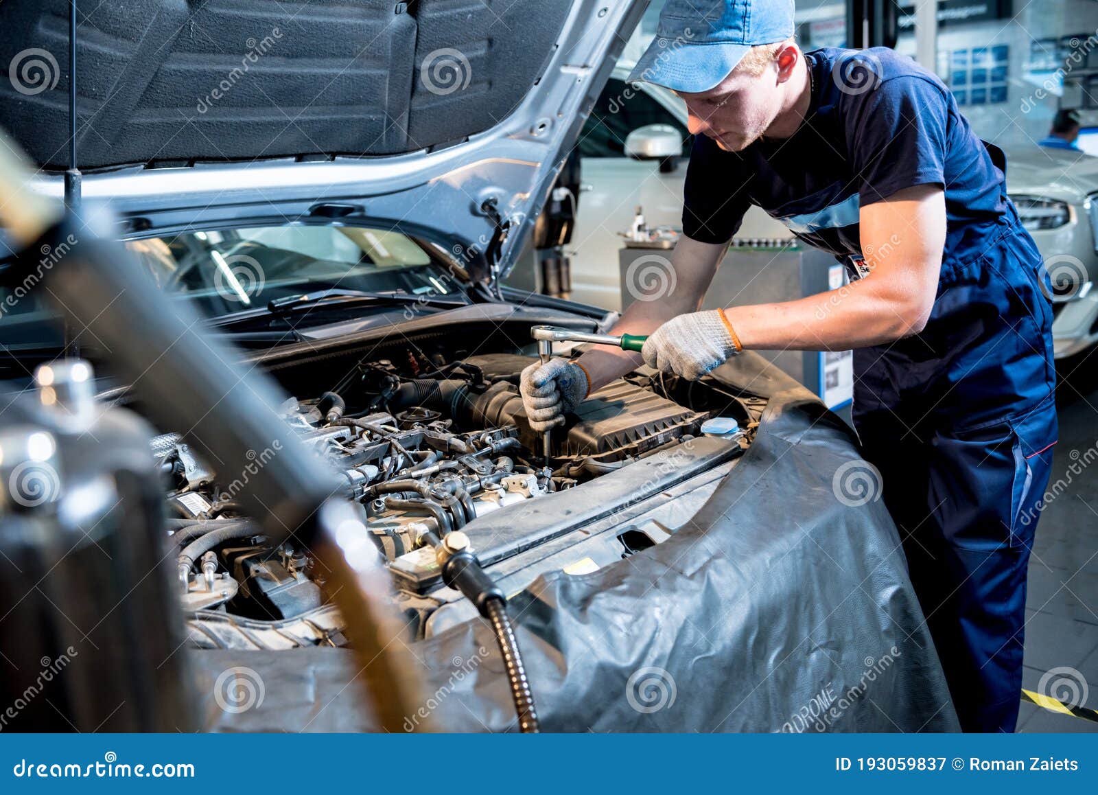 Car Mechanic Repair Engine at Service Station. Car Repair Stock Image