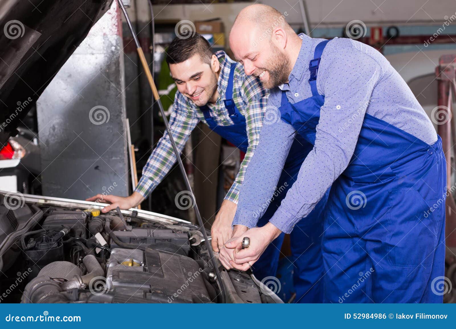 Car Mechanics Working at Carshop Stock Photo - Image of operate