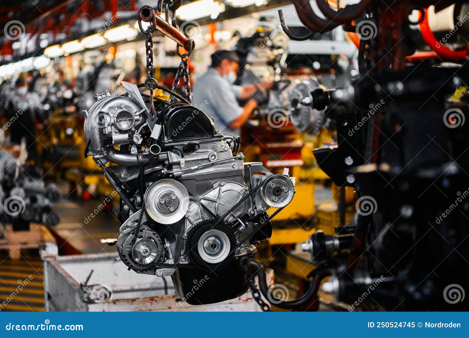 Car Motor Hangs on Chains in Assembling Plant Stock Image