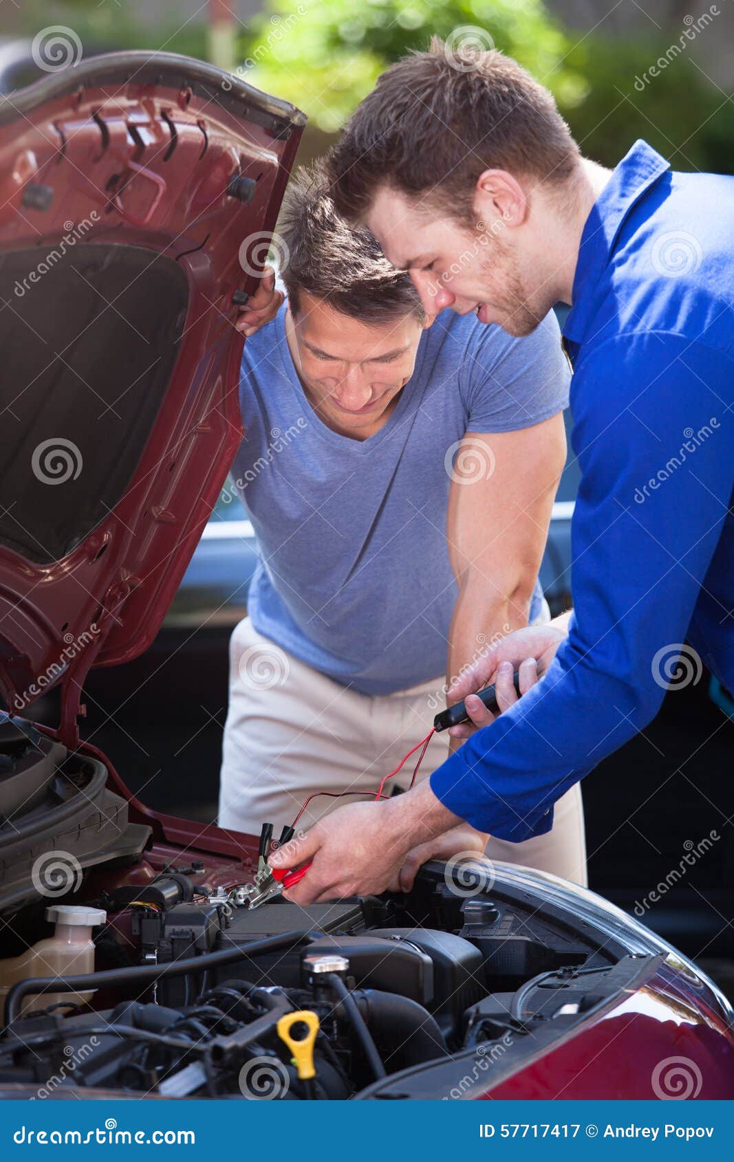 Car Owner with Mechanic Testing Car Battery Stock Image Image of