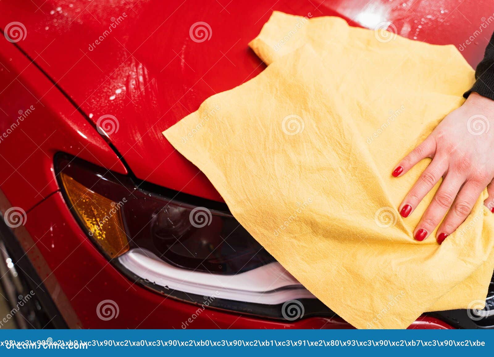 Car Polishing with Yellow Microfiber Cloth. Protection of Paintwork