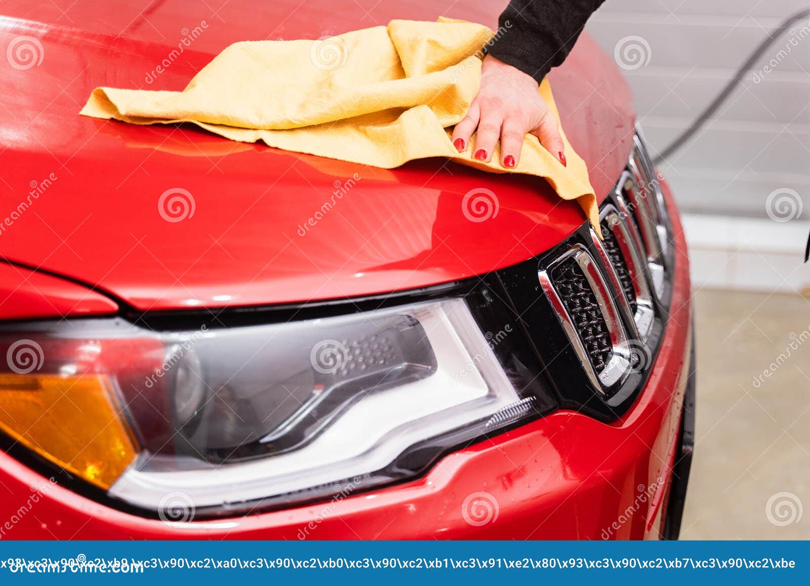 Car Polishing with Yellow Microfiber Cloth. Protection of Paintwork