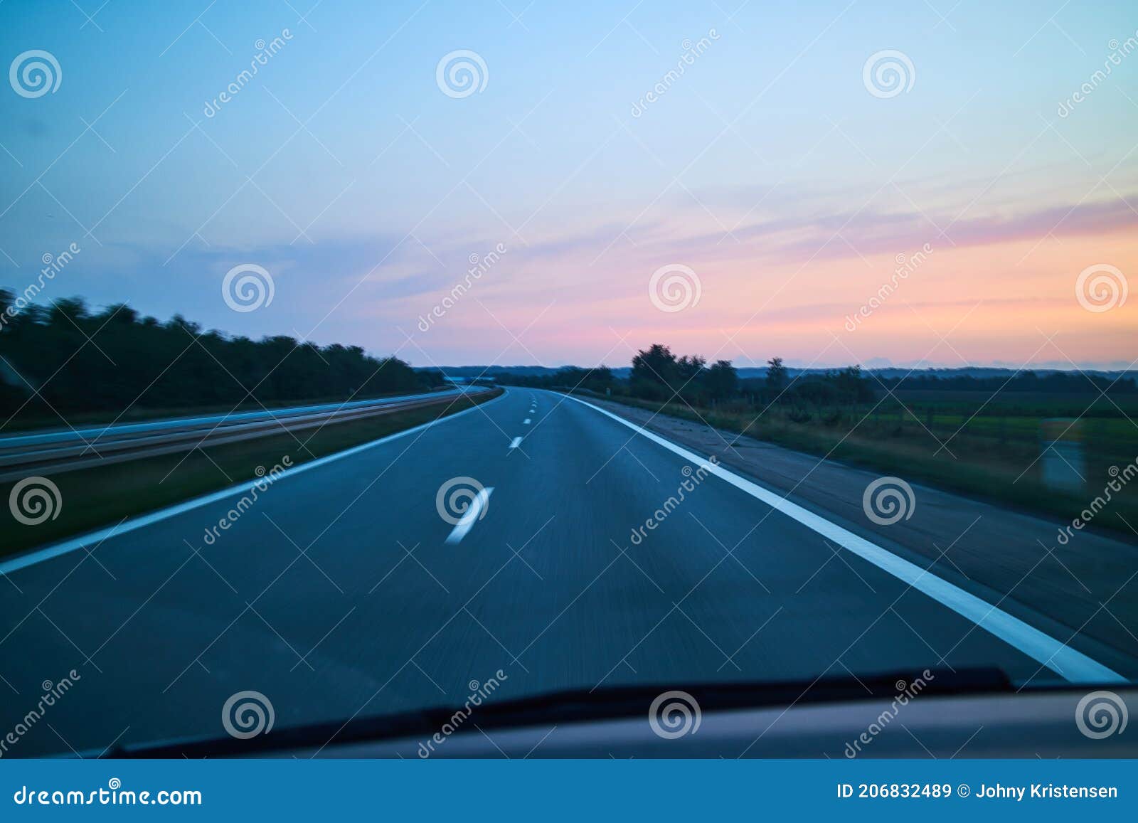 Car Ride in Purple Sunset on a Highway Stock Image Image of sunset