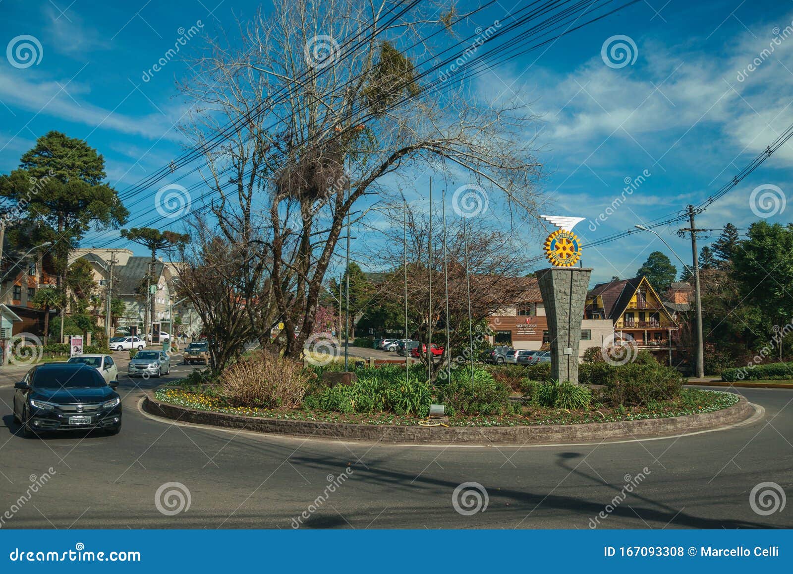 Car On Roundabout And Garden With Rotary Logo Editorial Stock