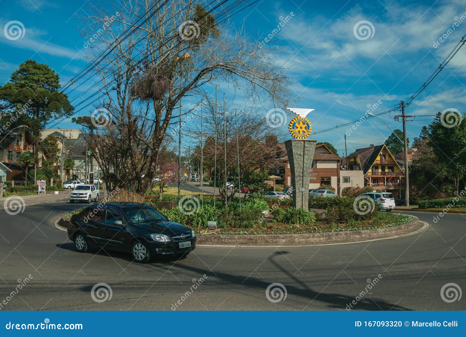 Car On Roundabout And Garden With Rotary Logo Editorial Image