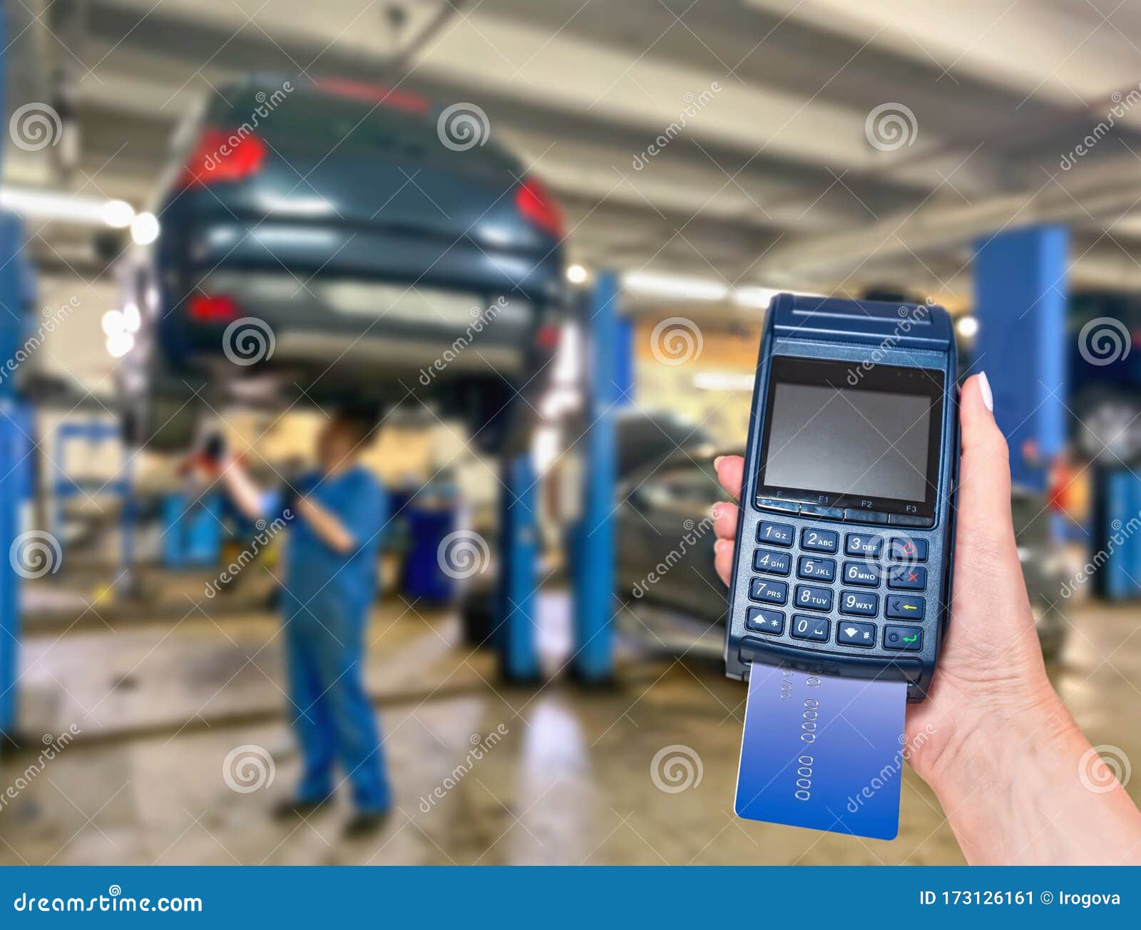 Car Service Payment of Car Repair Card with the Payment Terminal. Stock