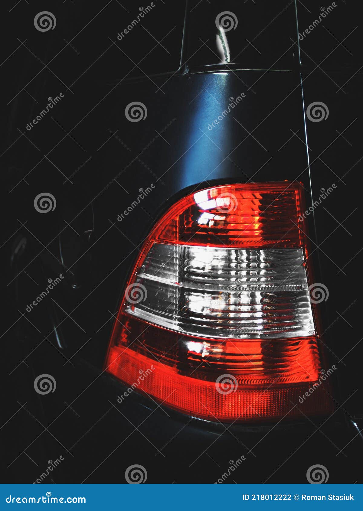 Car in the Shade. Car Headlights. Luxury Headlights. Car Details Stock