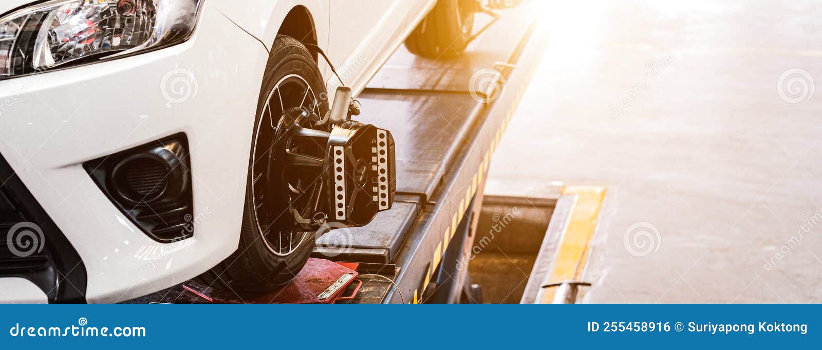 Car on Stand with Sensors on Wheels for Wheels Alignment Camber, Car