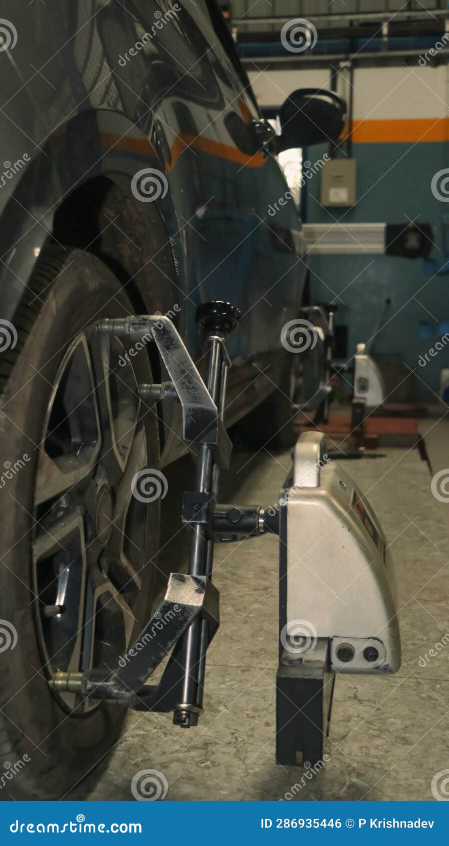 A Car Tire Under Maintenance and Correction of Steering Angles Stock