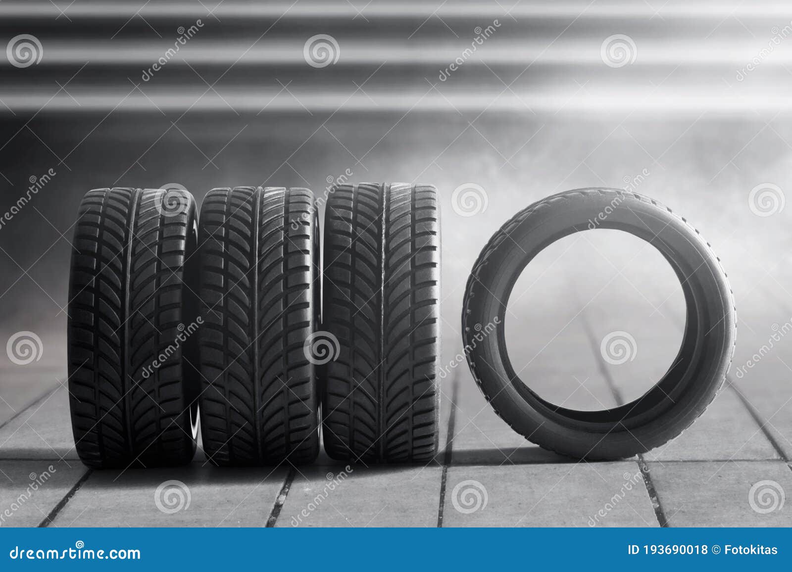 Car tires in the garages stock photo. Image of concept 193690018