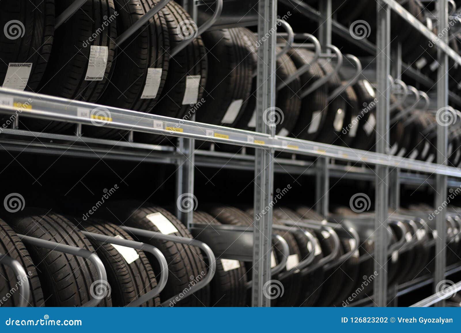 Car Tires and Wheels at Warehouse in Tire Store. Stock Photo Image of